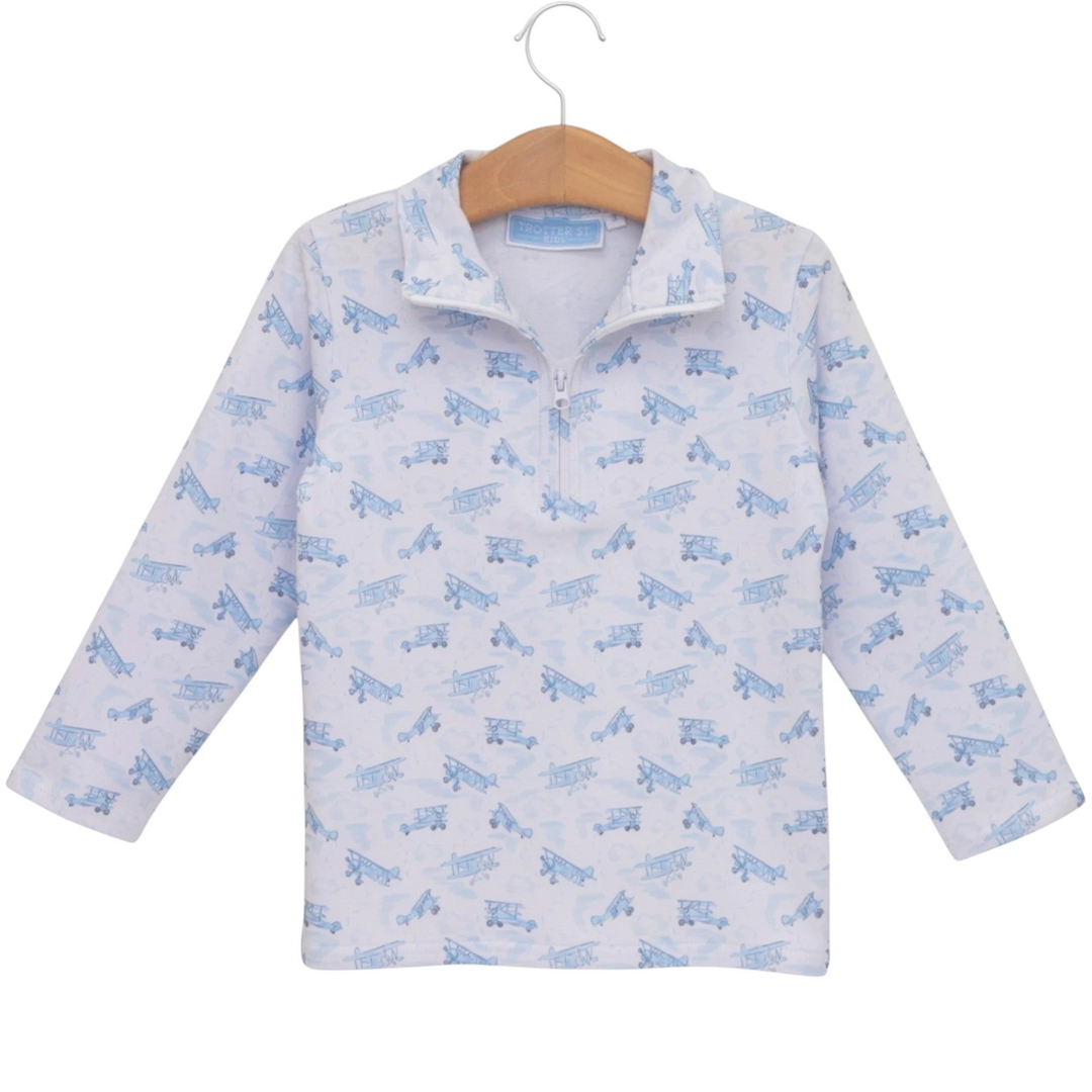 That Store boys blue airplane print 1/4 zip pullover in soft cotton blend fabric on a wooden hanger