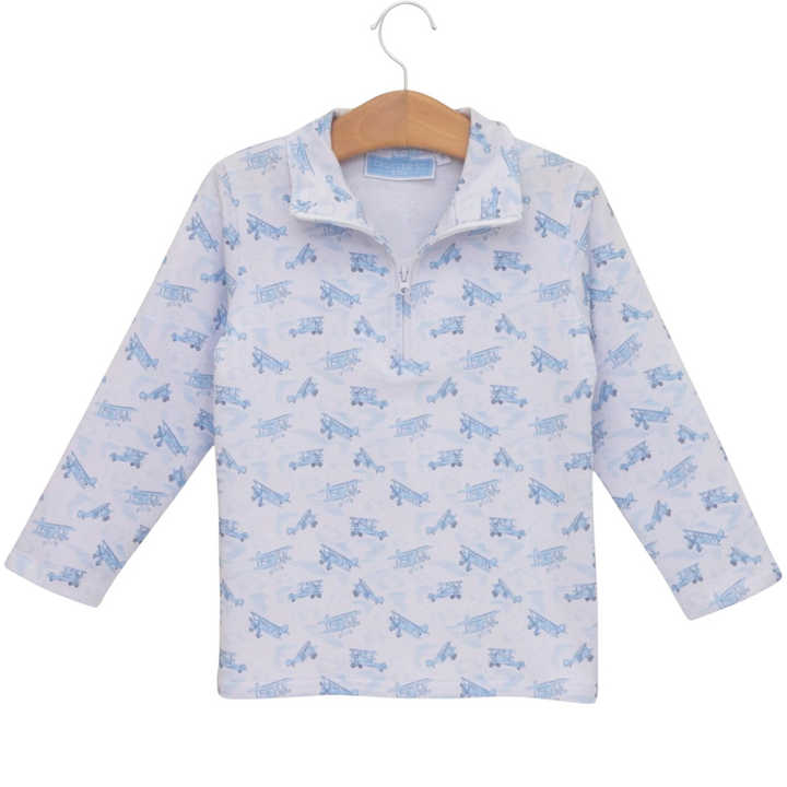 That Store boys blue airplane print 1/4 zip pullover in soft cotton blend fabric on a wooden hanger