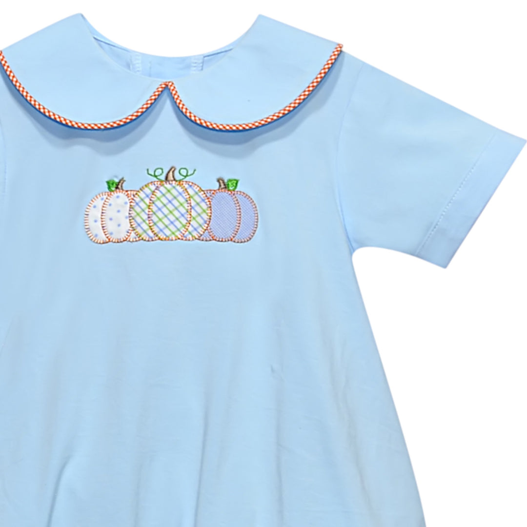 That Store boys blue cotton bubble featuring a charming pumpkin applique and orange gingham trim collar.