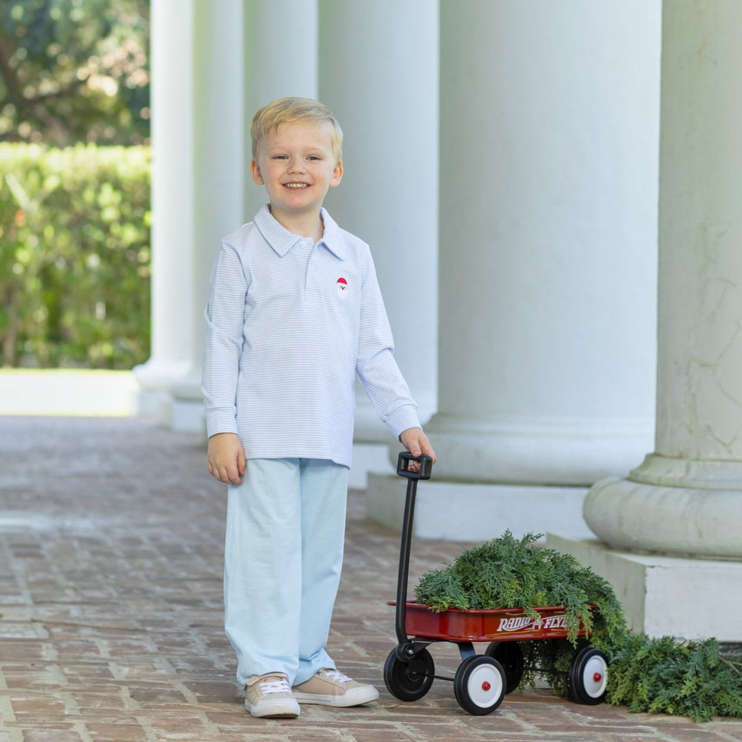 That Store boys blue stripe polo with embroidered Santa, worn by a smiling boy with a red toy wagon.
