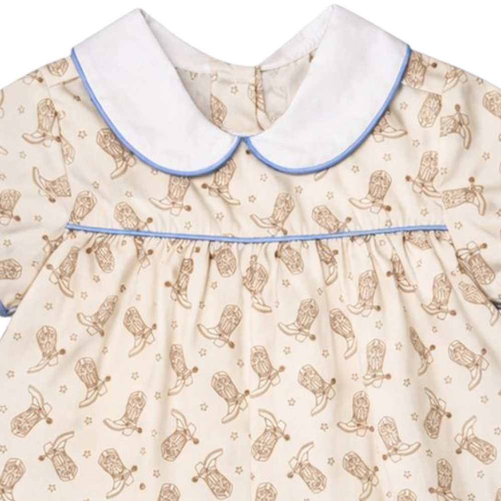 That Store boys bubble featuring a brown cowboy boot print, white peter pan collar, and blue piping detail.