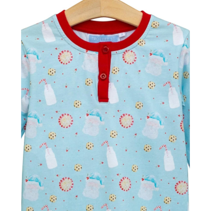 That Store boys lounge set featuring a blue Christmas print with Santa, milk, and cookies and red button placket.