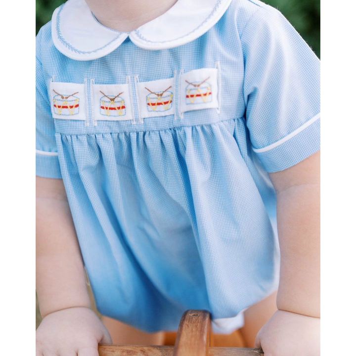 That Store boys bubble in river royal mini gingham with a white peter pan collar and embroidered drum ribbon detail.
