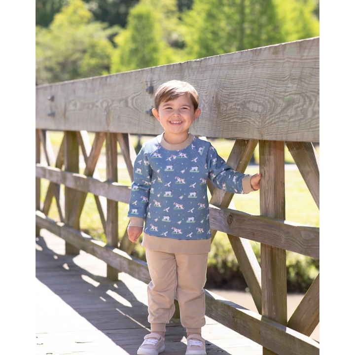 That Store boys green French terry set with hunting dog print, featuring a long-sleeve top and matching joggers.