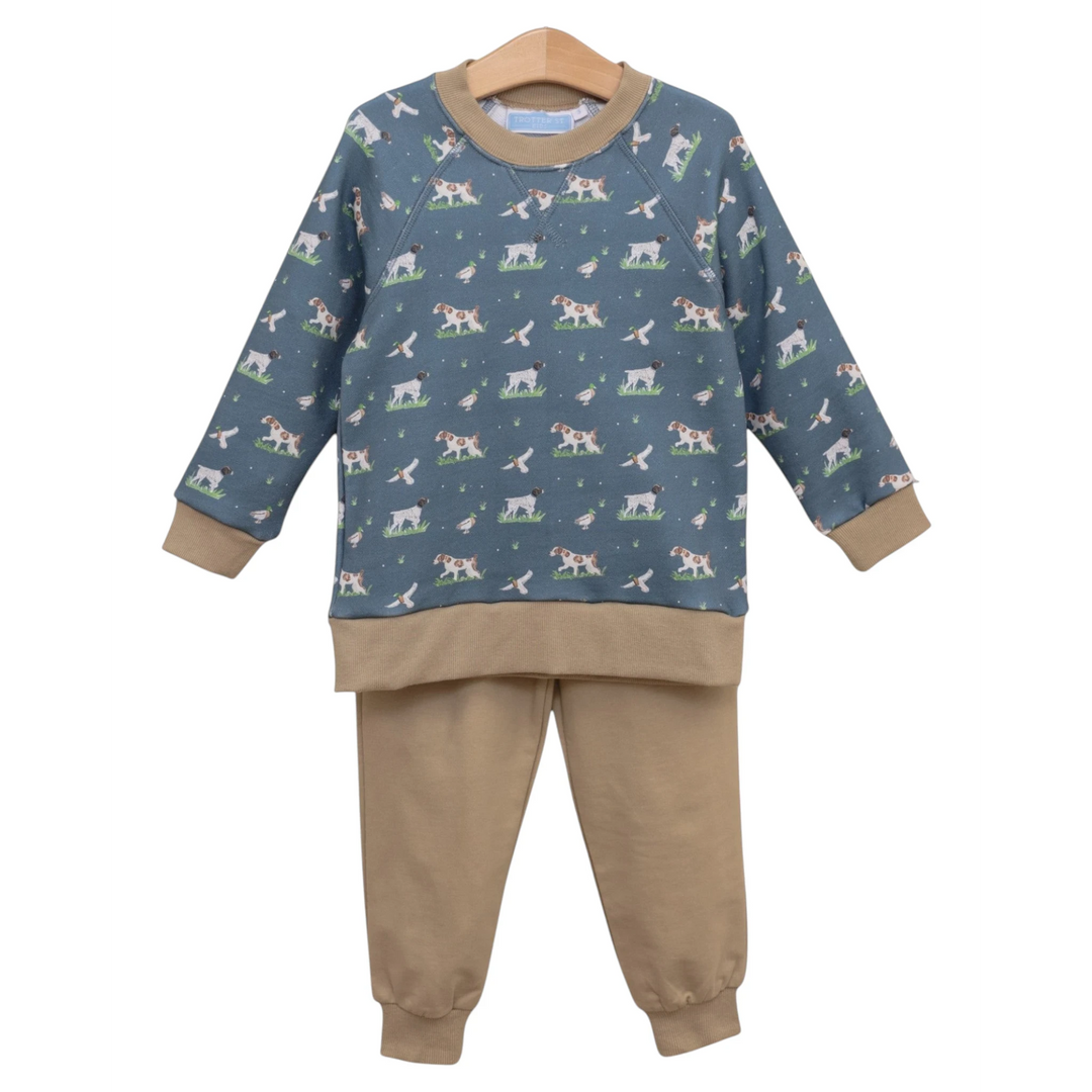 That Store boys green French terry two-piece set featuring a dog and duck print sweatshirt and solid tan joggers.