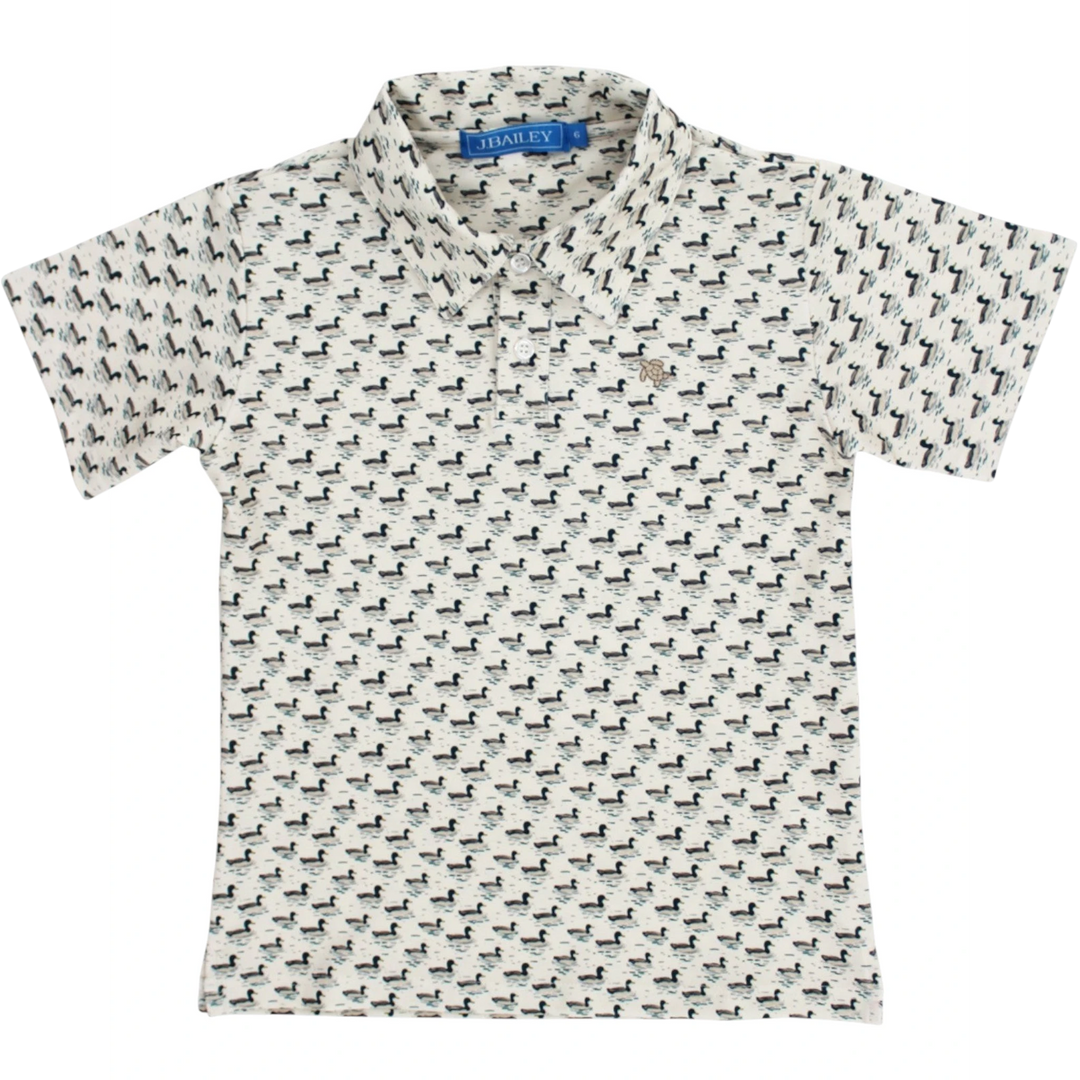 That Store boys performance polo in cream with an allover mallard duck print and classic collar