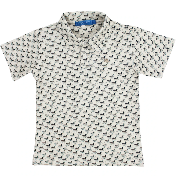 That Store boys performance polo in cream with an allover mallard duck print and classic collar