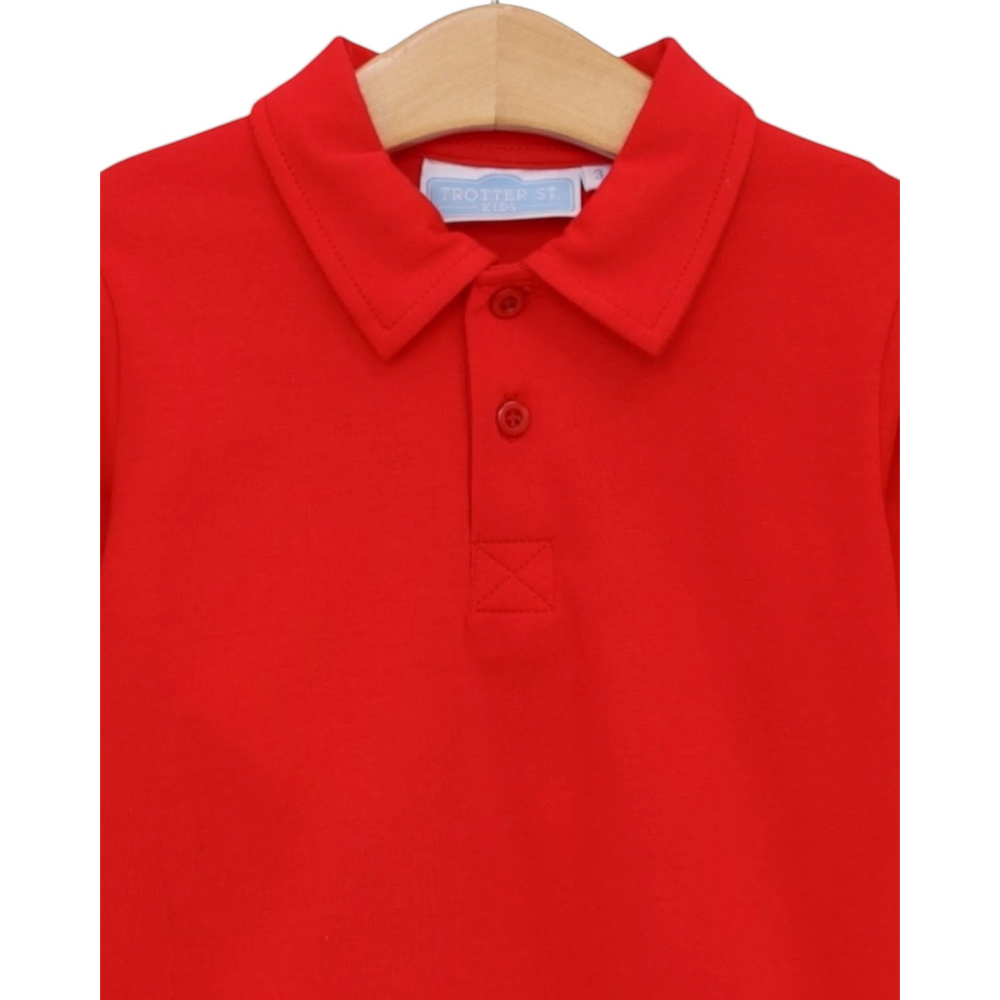 That Store boys red polo shirt in soft cotton blend with a classic collar and two-button placket.