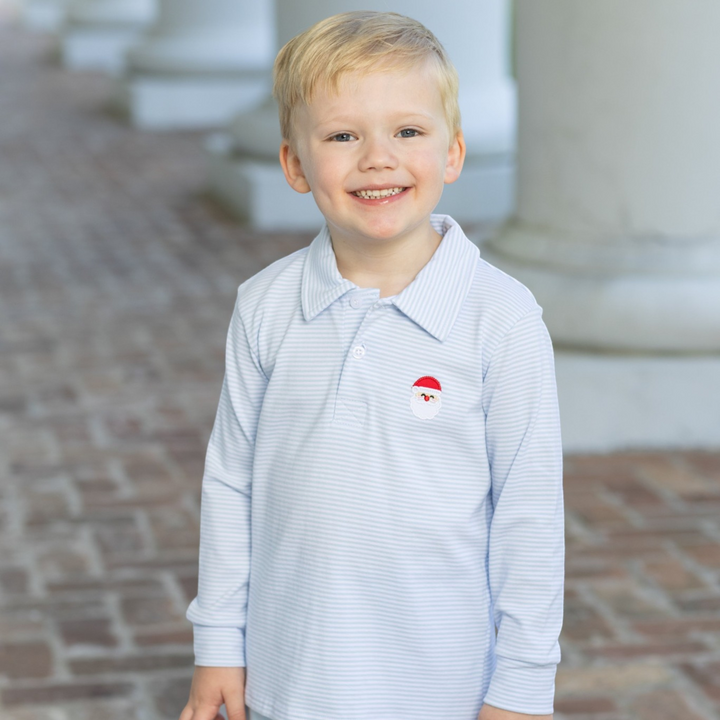 That Store boys long sleeve polo in blue stripe with embroidered Santa detail worn by a smiling young boy