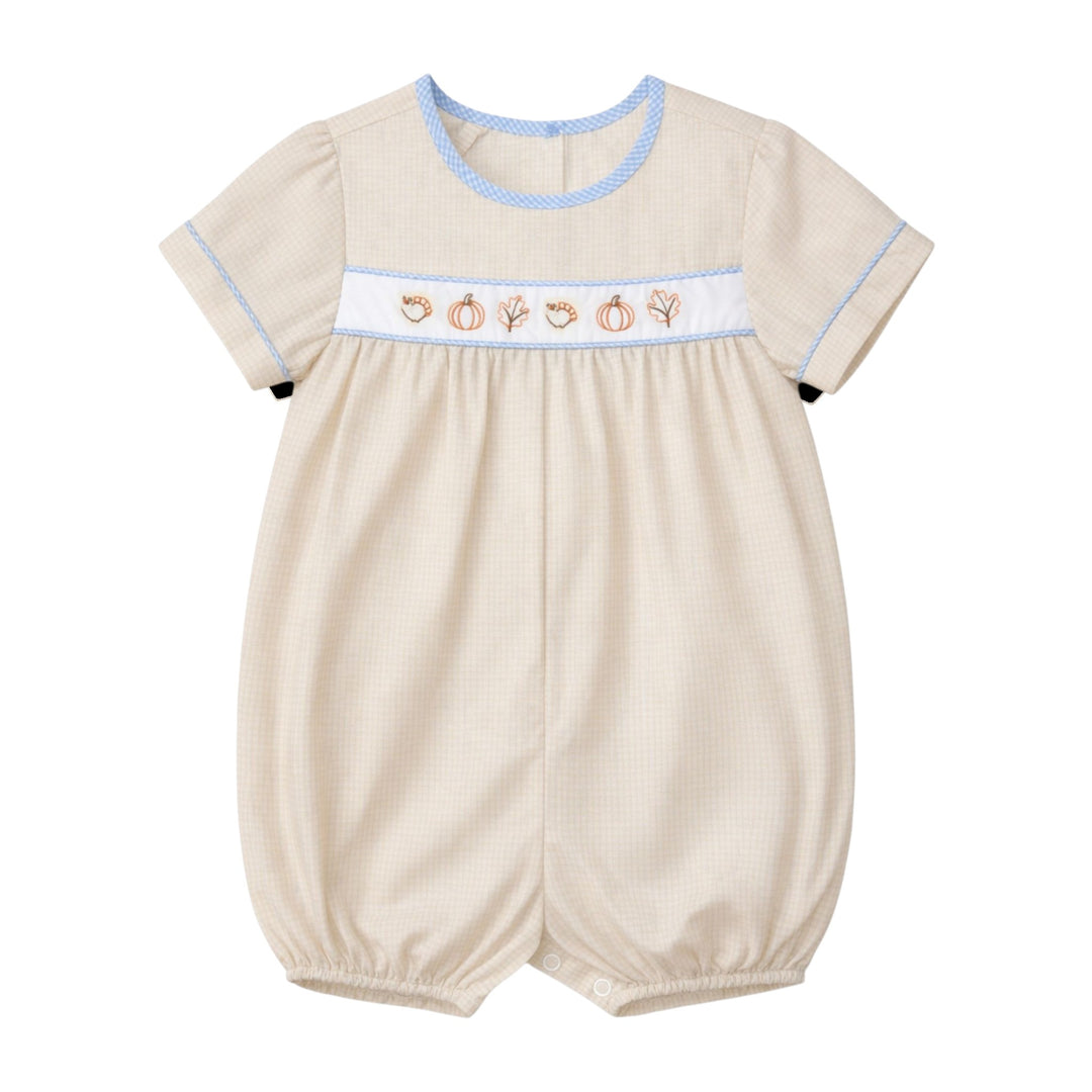 That Store boys brown gingham bubble with embroidered turkeys, pumpkins, and leaves, featuring blue trim.