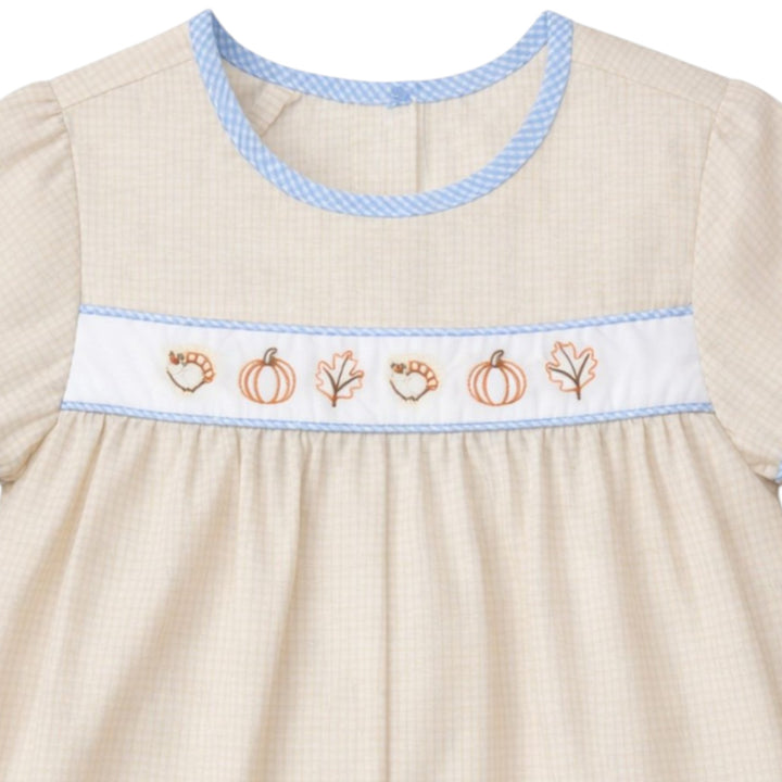 That Store boys brown gingham bubble with embroidered turkeys, pumpkins, and leaves, featuring blue trim details.