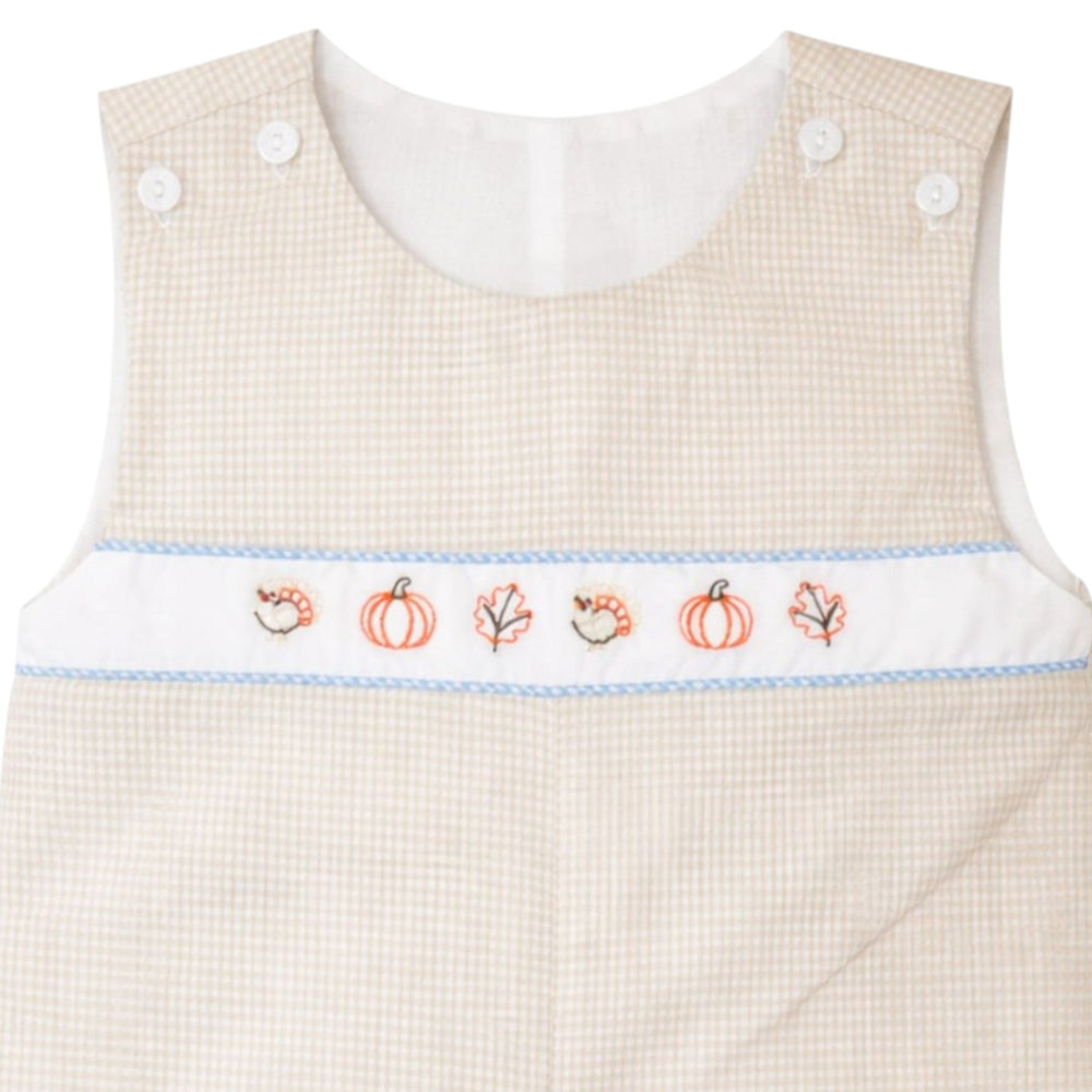 That Store brown gingham jon jon for boys featuring embroidered fall pumpkins, leaves, and turkeys on the chest.