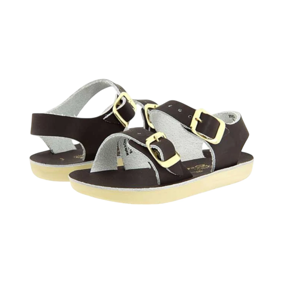 That Store brown water-friendly leather baby sandals with two adjustable brass buckle straps and flexible soles.