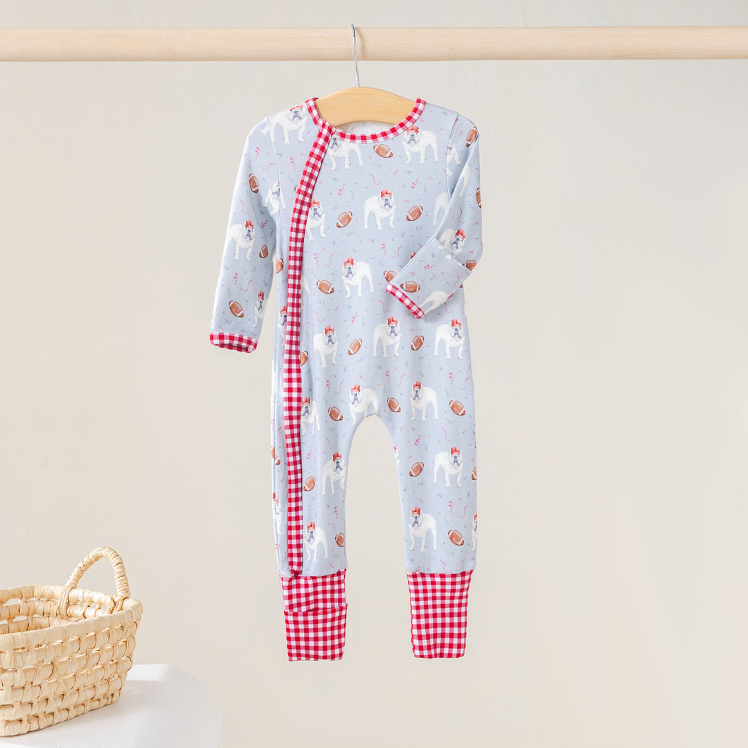 That Store organic cotton kids zip-up pajamas featuring a light blue bulldog and football print with red gingham trim
