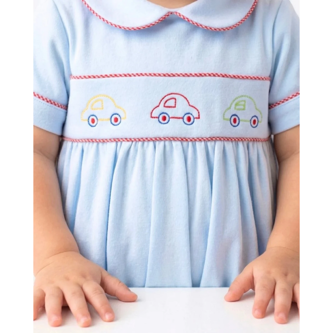 That Store Carson boys bubble in Bluffton Blue knit with red and white trim and embroidered colorful car designs.