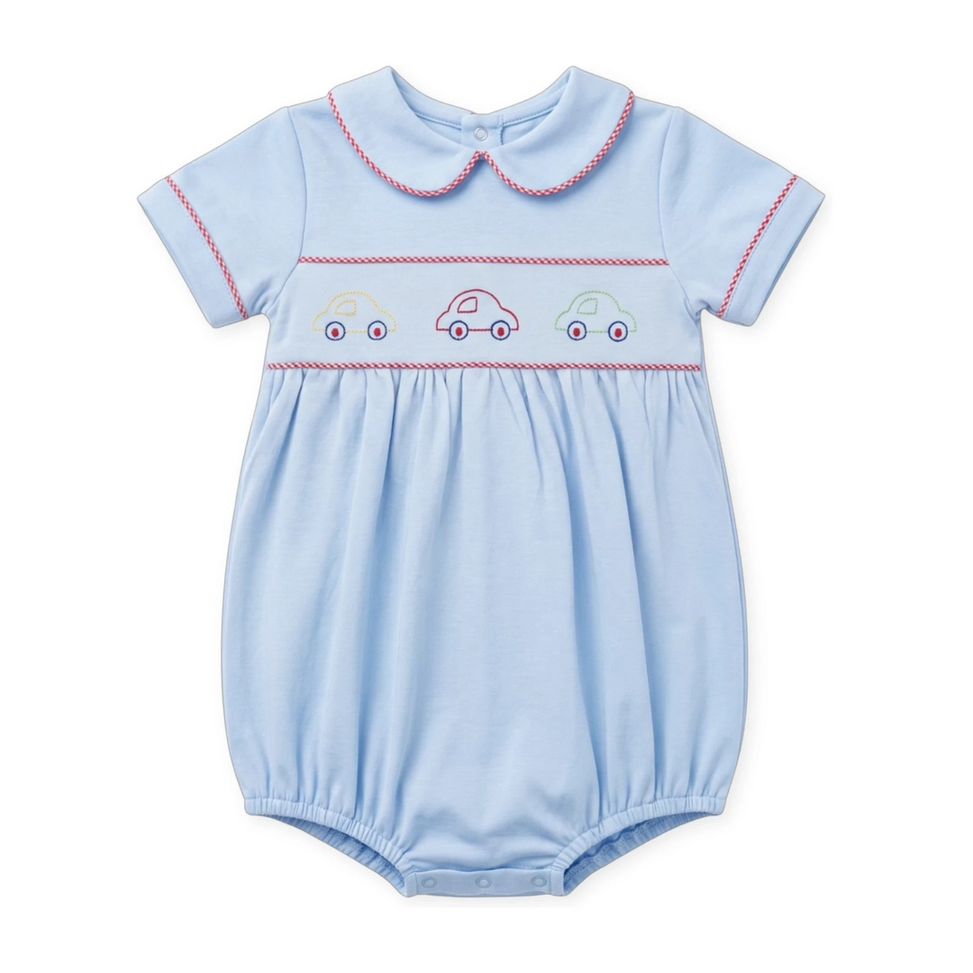 That Store Carson bubble in Bluffton Blue with red and white gingham trim and embroidered car motifs on the chest.