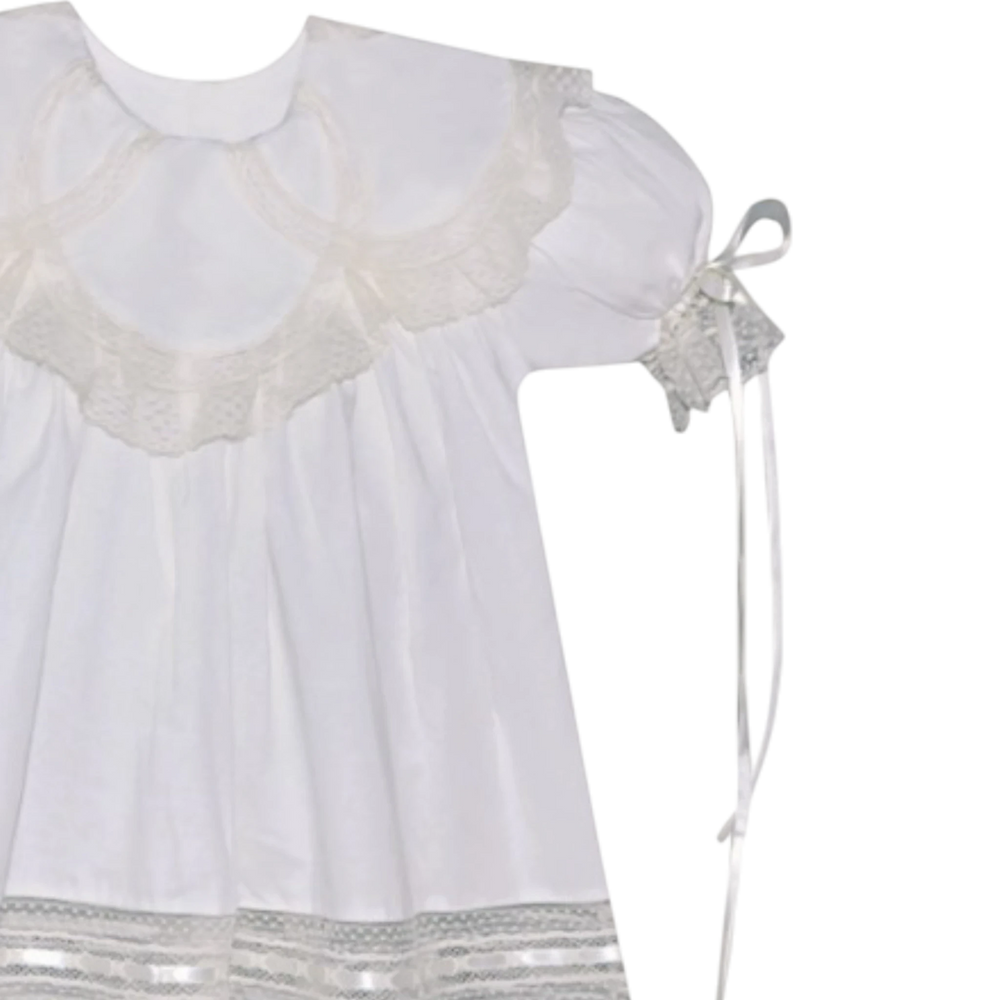 That Store Charlie heirloom dress in vintage white with ecru lace, petal collar, and satin ribbon sleeve ties.