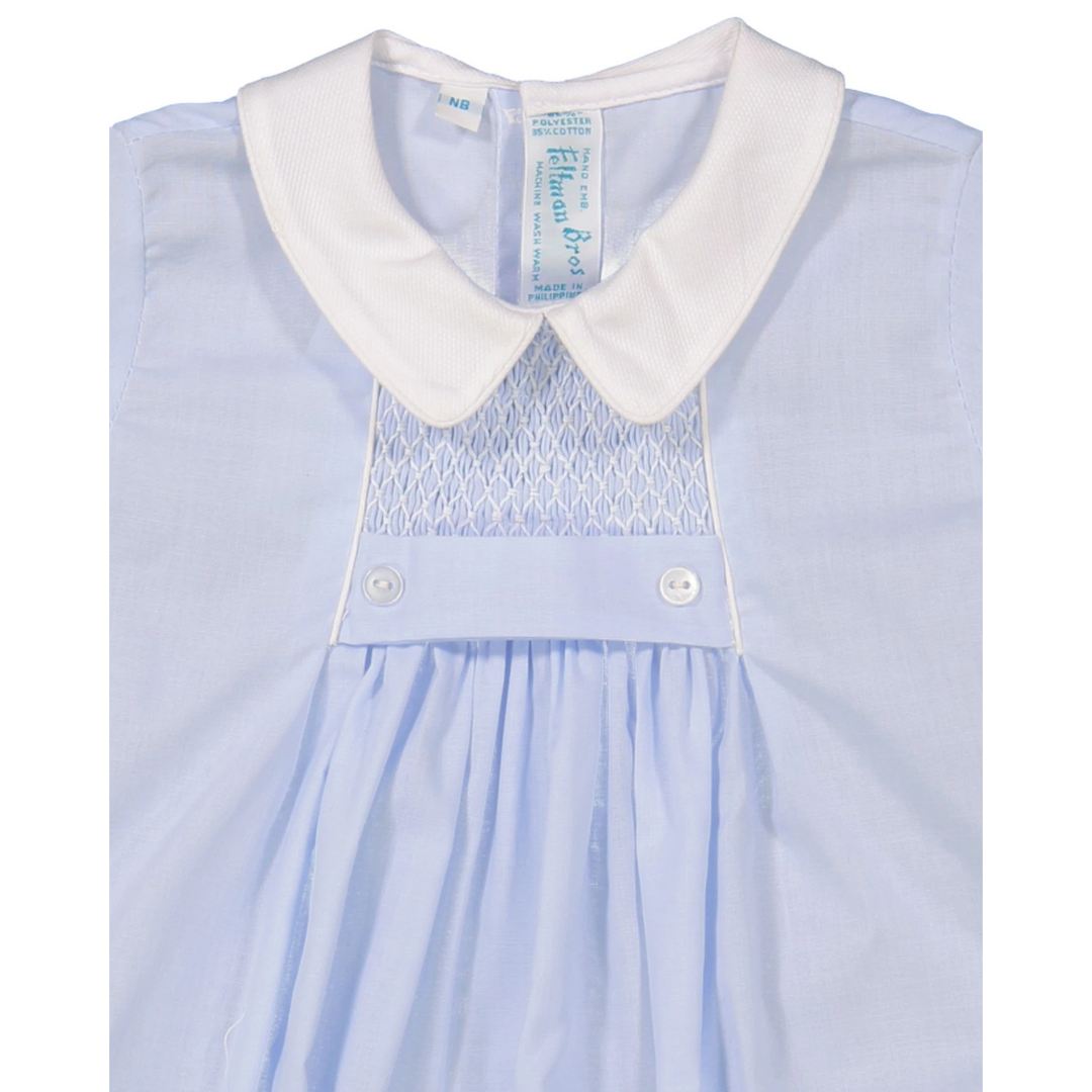 That Store blue boys creeper with white pique collar, chevron smocking, and tuxedo-style button waistband detail.