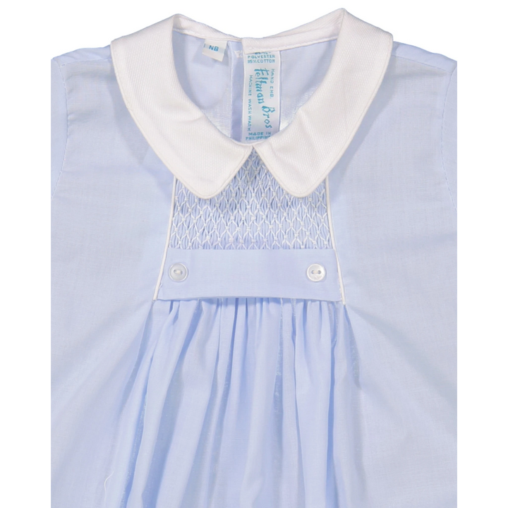 That Store blue boys creeper with white pique collar, chevron smocking, and tuxedo-style button waistband detail.