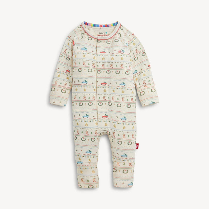 That Store RightFit magnetic baby coverall in cream with a festive Christmas print of cars, trees, and wreaths.