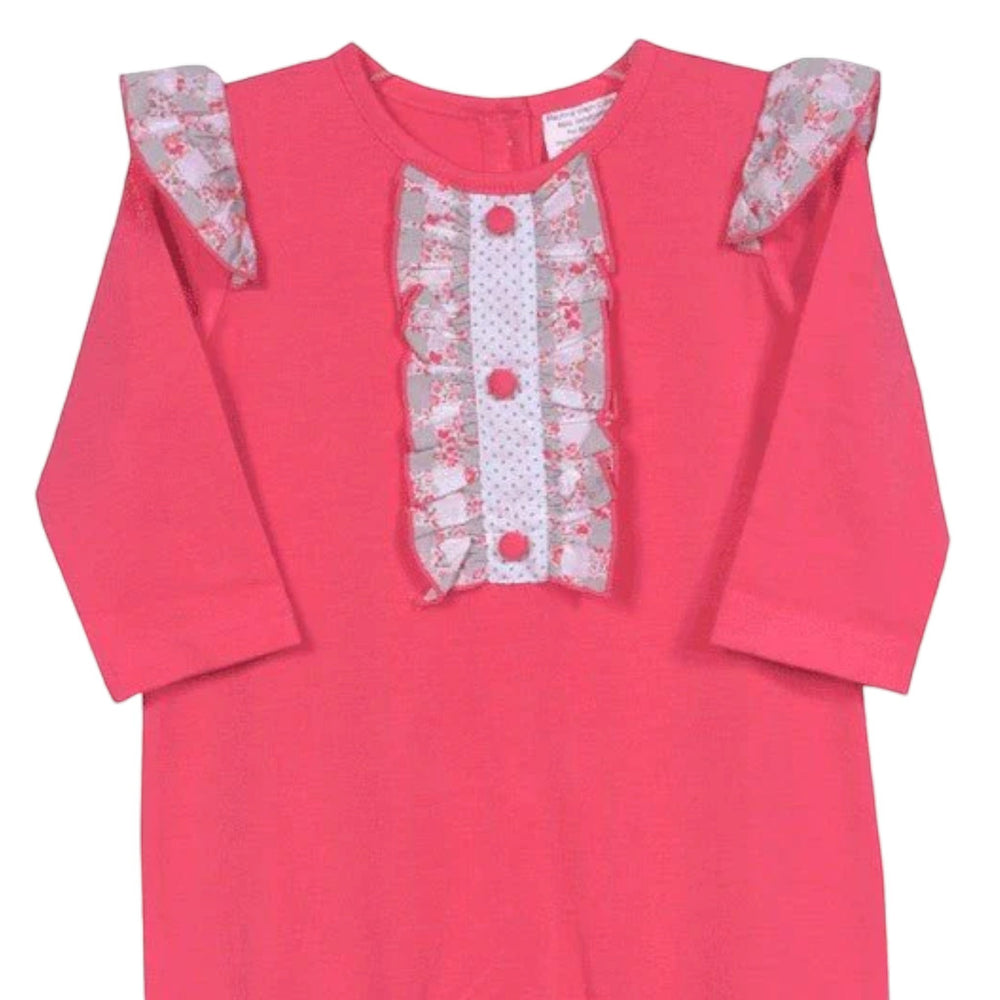 That Store coral cotton long-sleeve romper with floral ruffles, polka dot placket, and angel wing shoulder details.