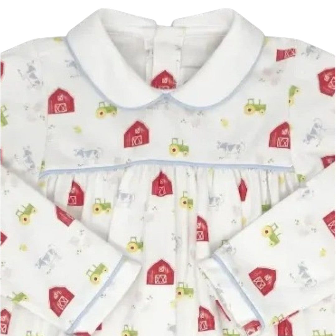 That Store Covington bubble in white knit with a barnyard tales print, featuring light blue piping and long sleeves.
