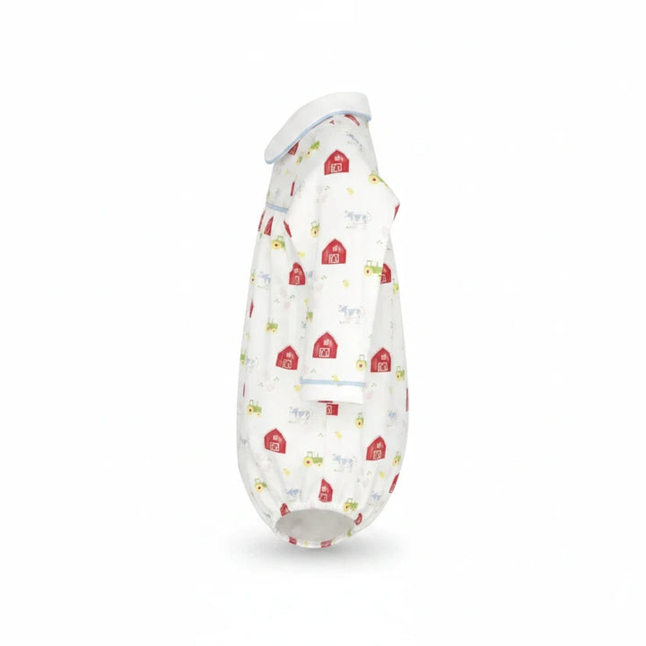 That Store Covington bubble in white knit fabric with a red barnyard tales print and light blue piping details.