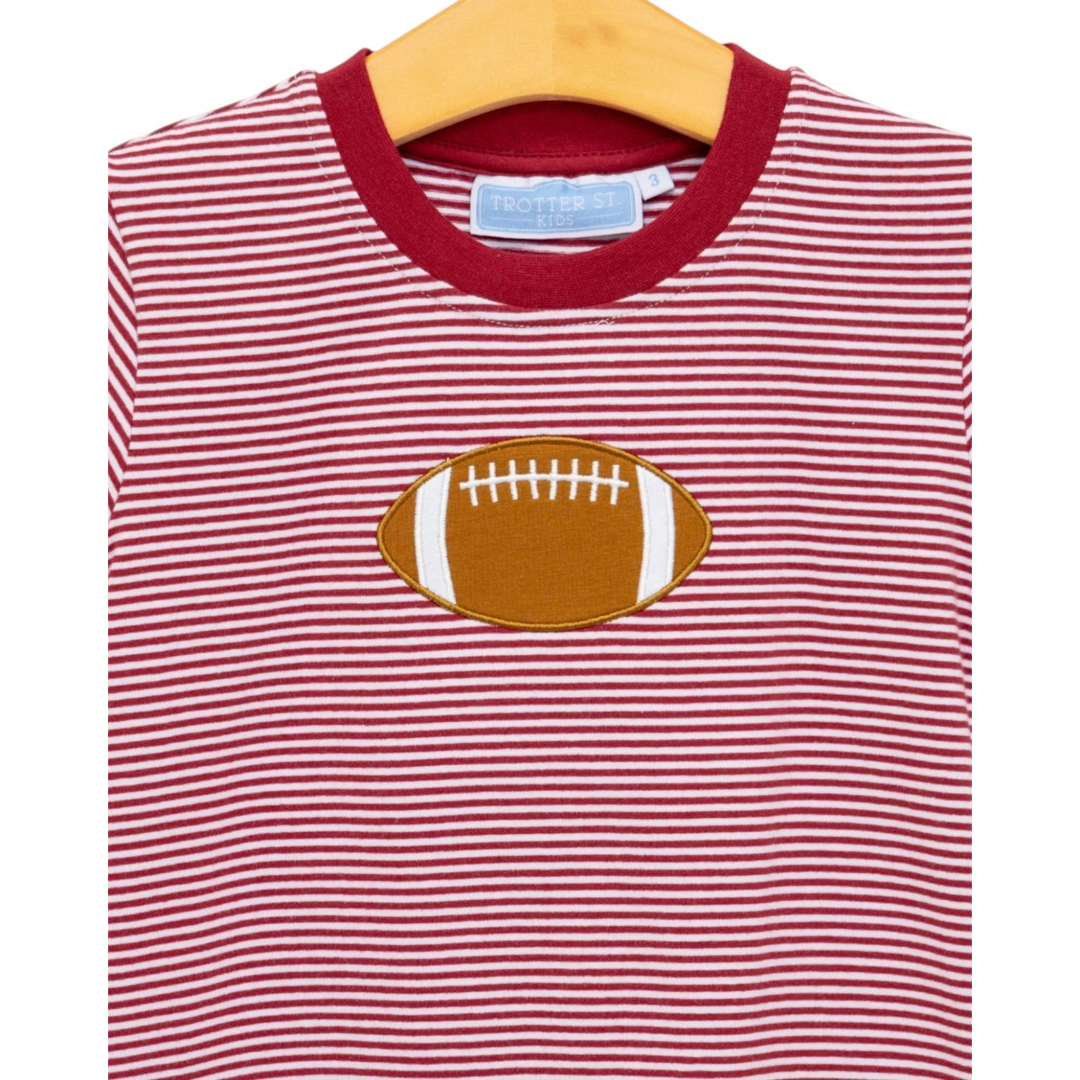That Store boys crimson and white striped cotton football applique t-shirt on a wooden hanger