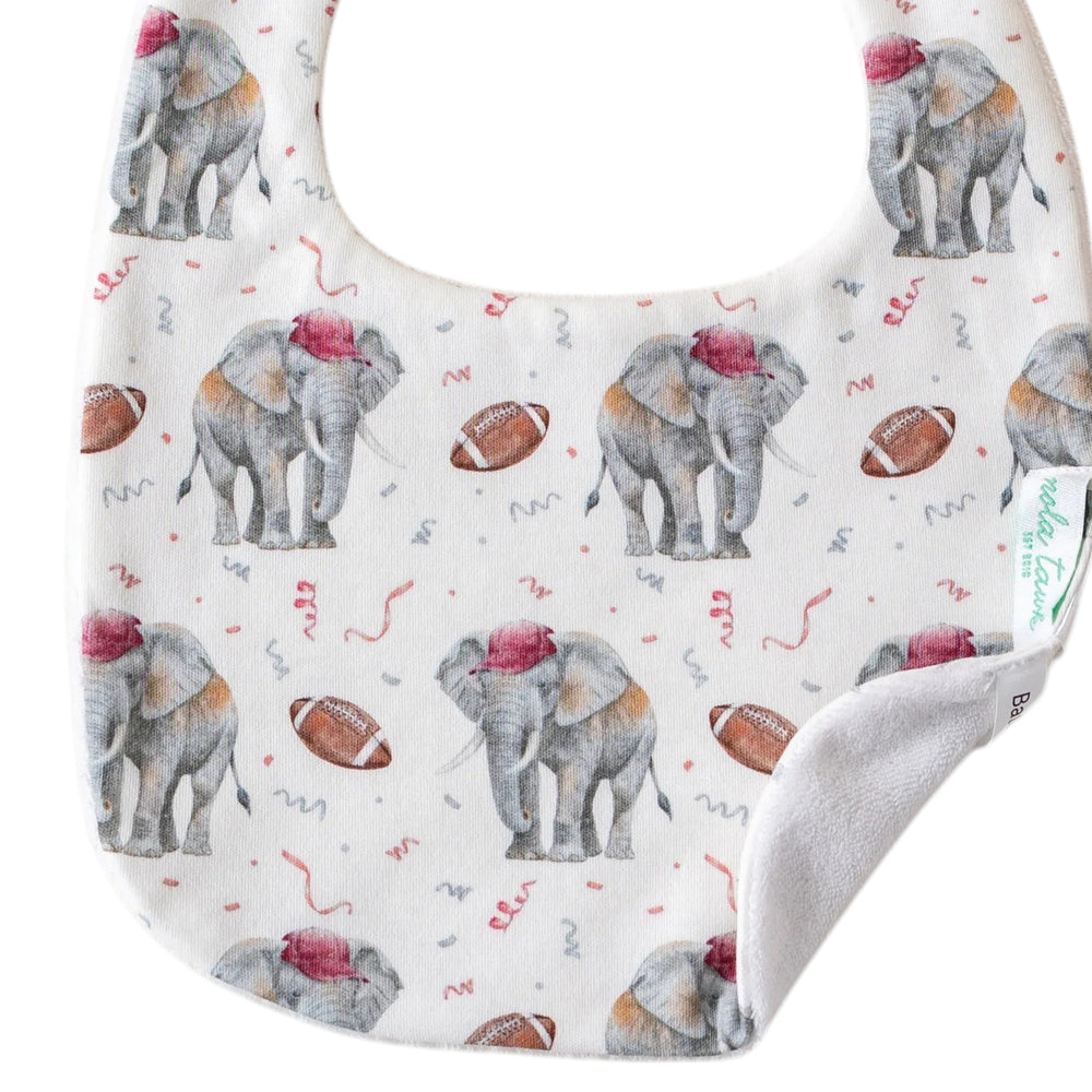 That Store organic cotton baby bib featuring a cute elephant and football print with an absorbent terrycloth back
