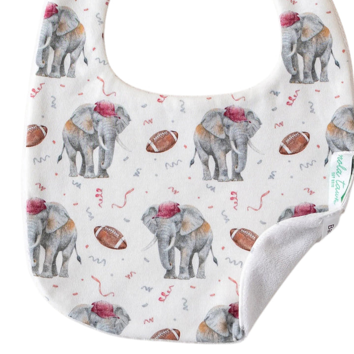 That Store organic cotton baby bib featuring a cute elephant and football print with an absorbent terrycloth back