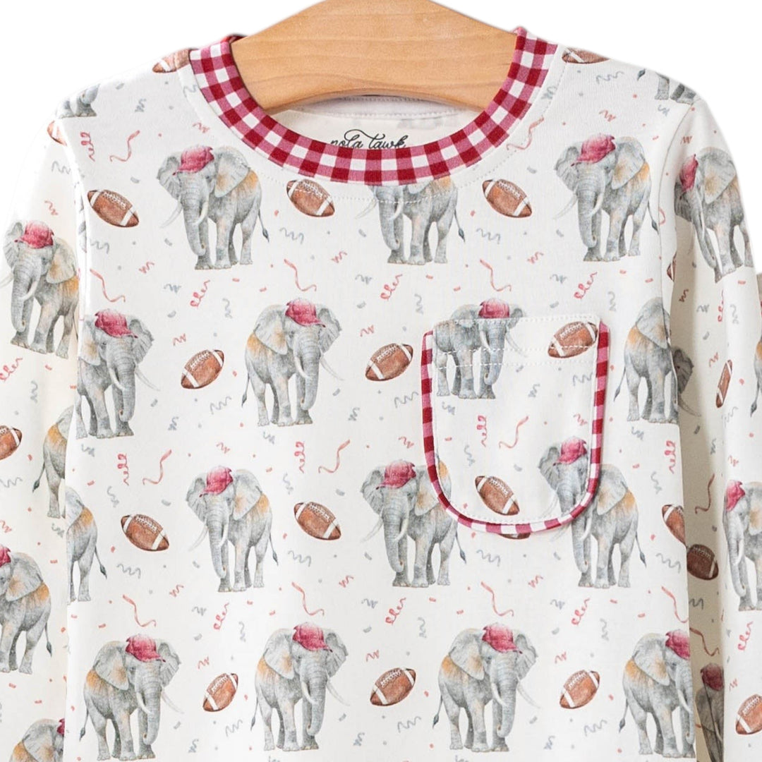 That Store organic cotton kids pajamas featuring an elephant and football print with red gingham trim on a hanger