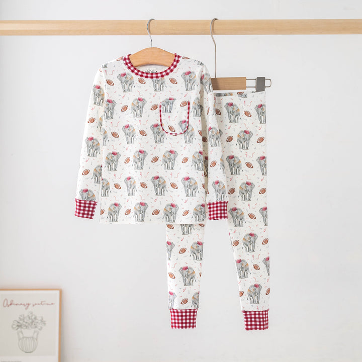 That Store organic cotton kids pajamas featuring an elephant and football print with red gingham trim