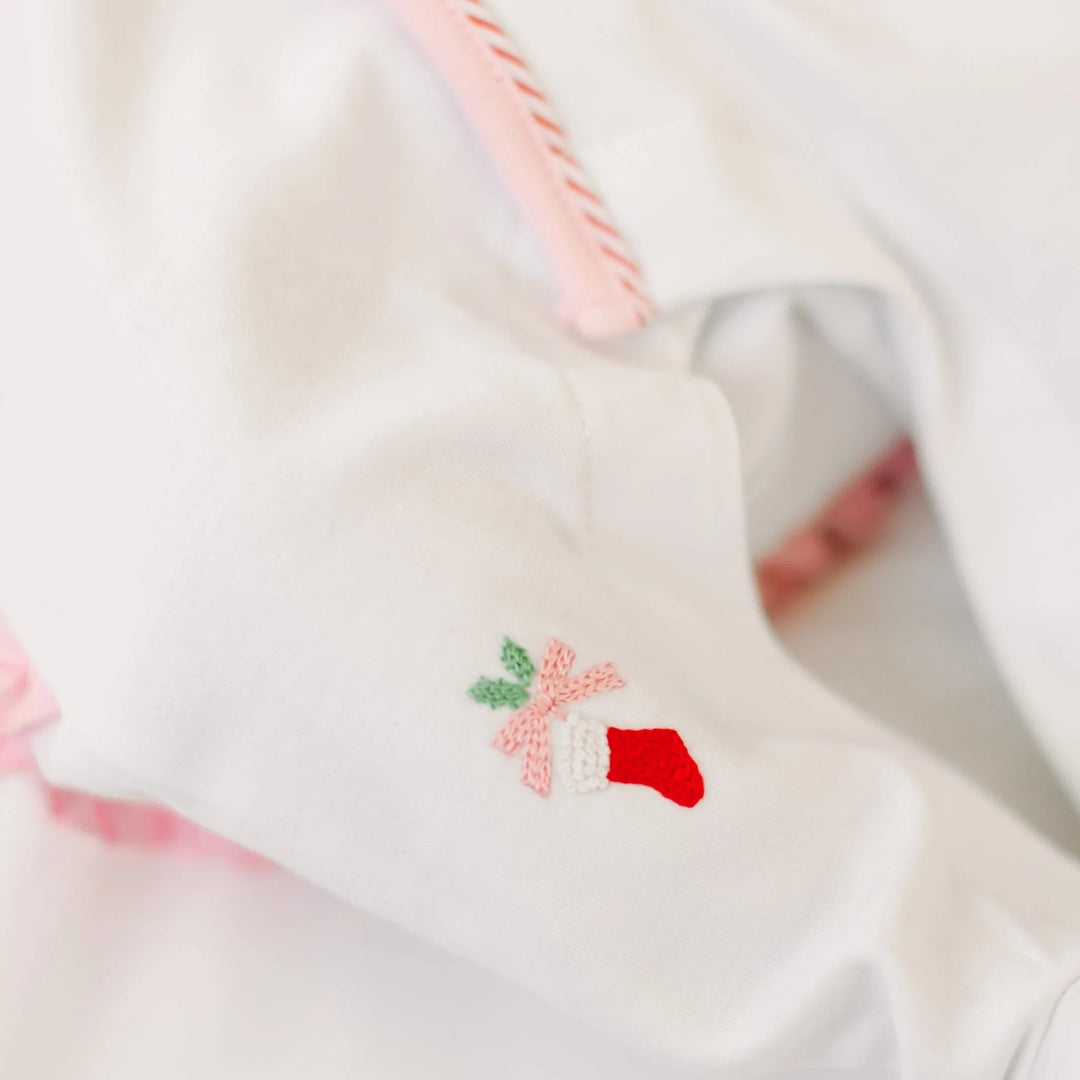 That Store white cotton girls footie featuring delicate hand-embroidered Christmas stocking and pink picot trim