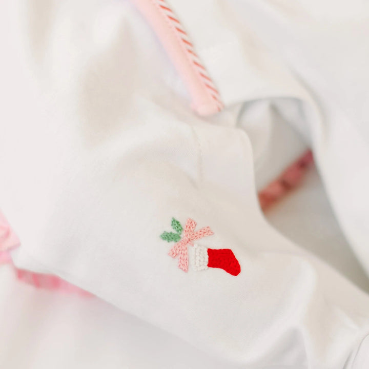 That Store white cotton girls footie featuring delicate hand-embroidered Christmas stocking and pink picot trim