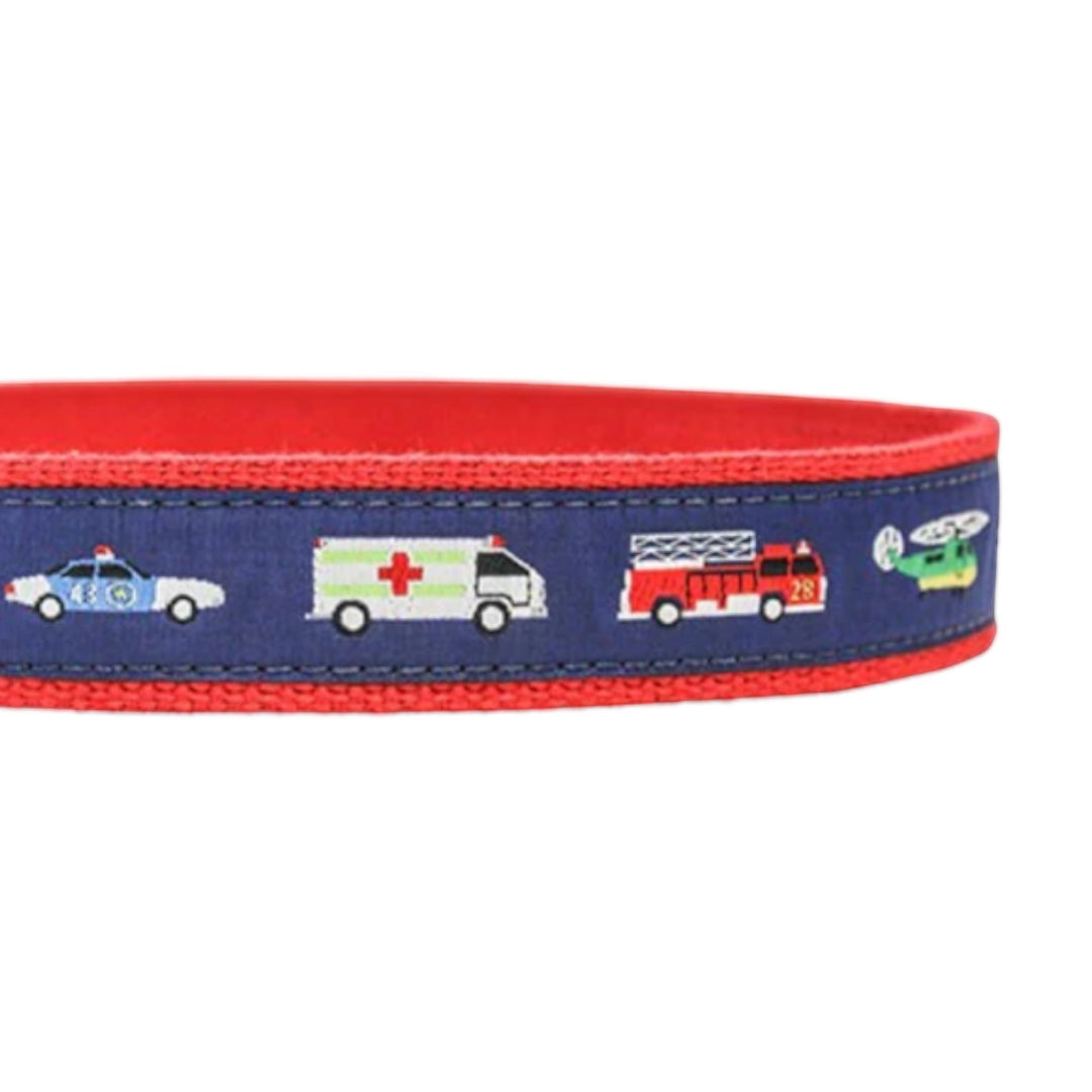 That Store boys emergency vehicle belt featuring colorful rescue trucks and helicopters on a blue and red fabric band
