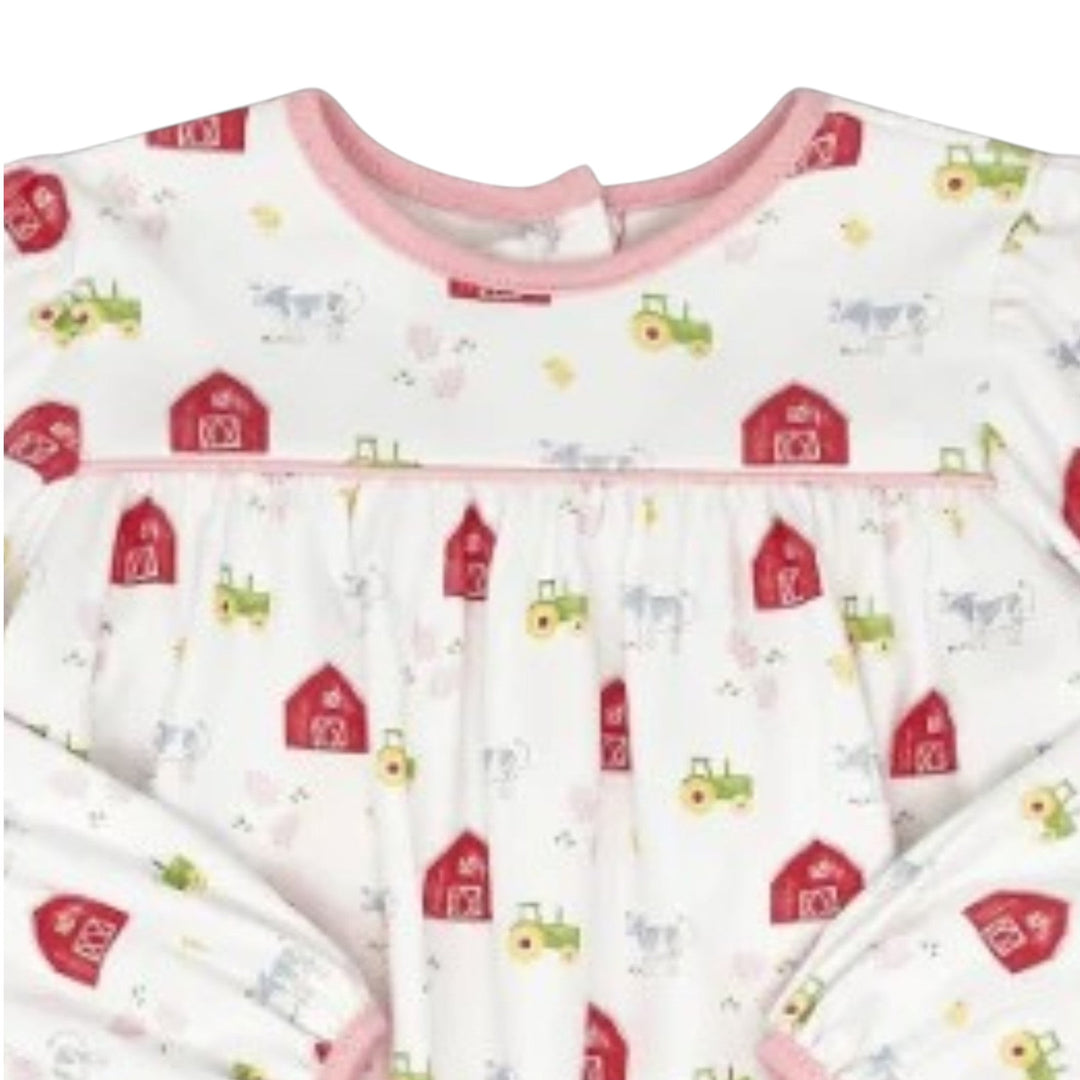 That Store infant top in white with a whimsical red barn and farm animal print, featuring pink trim and long sleeves.
