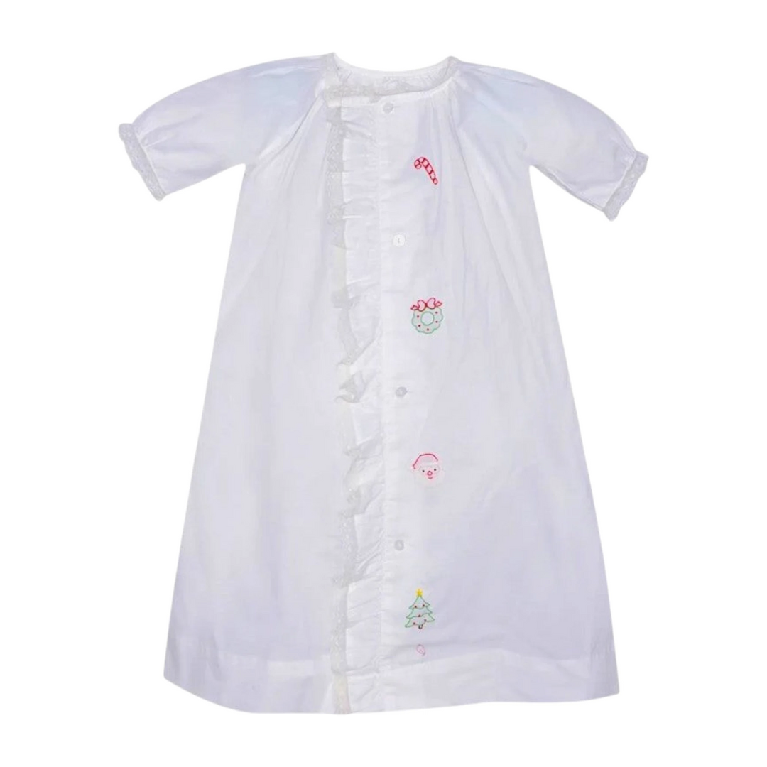 That Store Finn white baby girls daygown with festive holiday embroidery, ruffled lace trim, and front button closure.