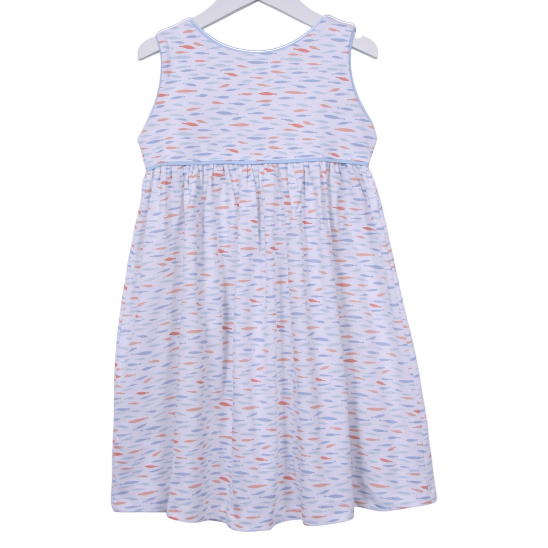 That Store girls dress in white Pima cotton with blue and orange fish print, blue piping, and back button closure.