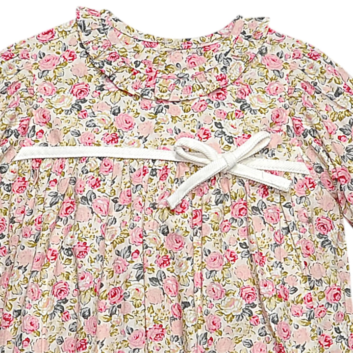 That Store girls bubble featuring a vintage pink rose floral print, ruffled collar, and a white ribbon bow detail.