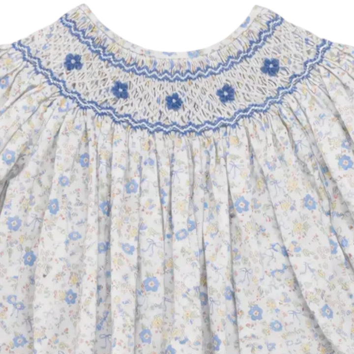 That Store girls smocked bubble in blue and yellow bow floral print with detailed blue chest smocking, 100% cotton.
