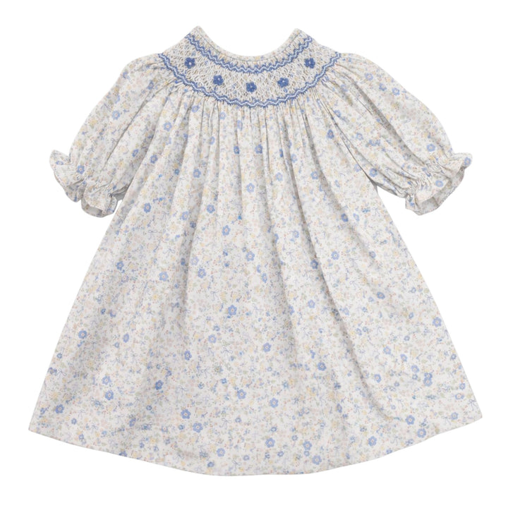 That Store girls cotton dress featuring a blue and yellow floral bow print with classic smocking on the chest