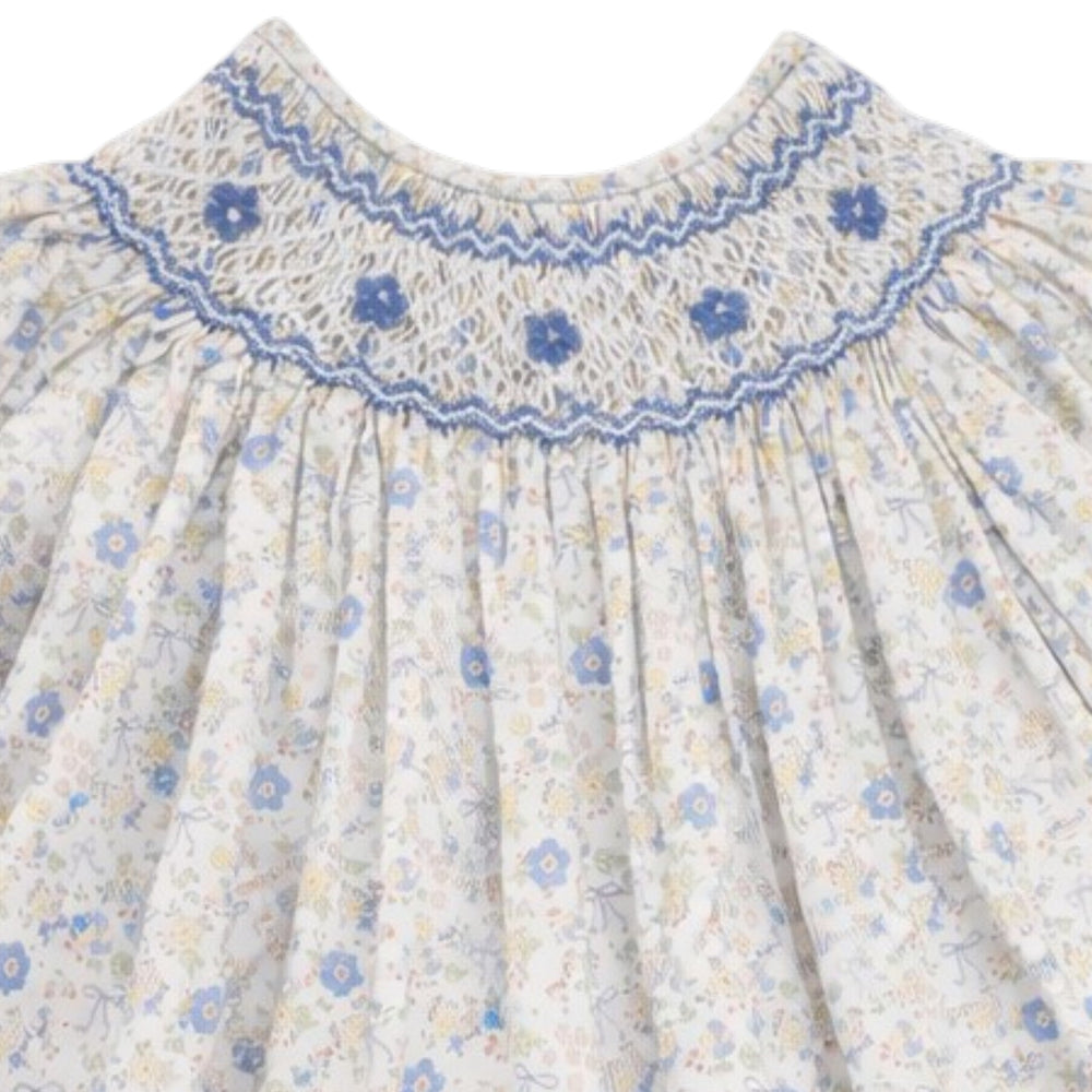 That Store girls cotton dress with blue and yellow floral bow print and intricate blue smocking on the chest