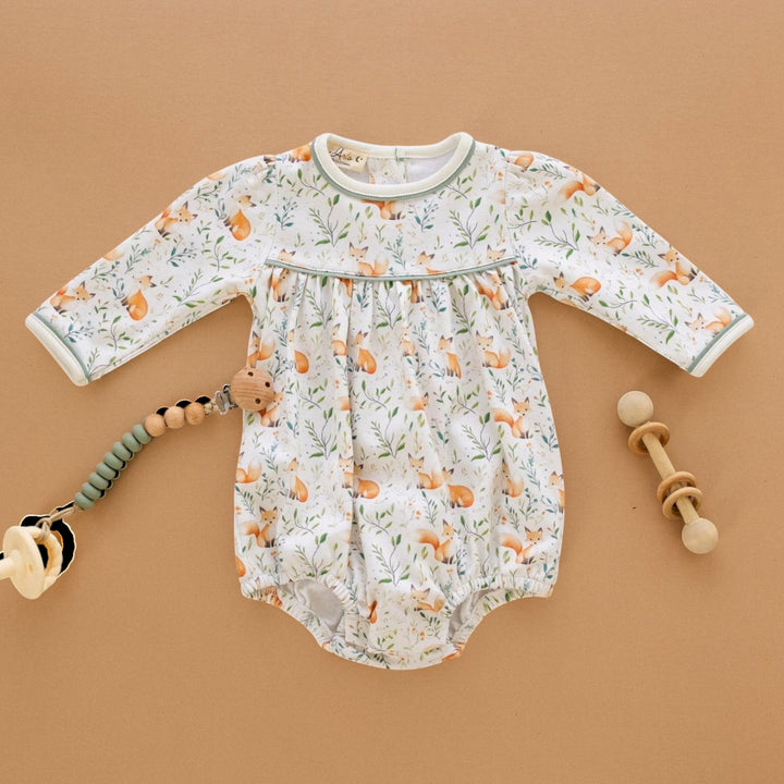 That Store Fox Tales long sleeve baby bubble in soft Pima cotton with a woodland fox print and green trim.