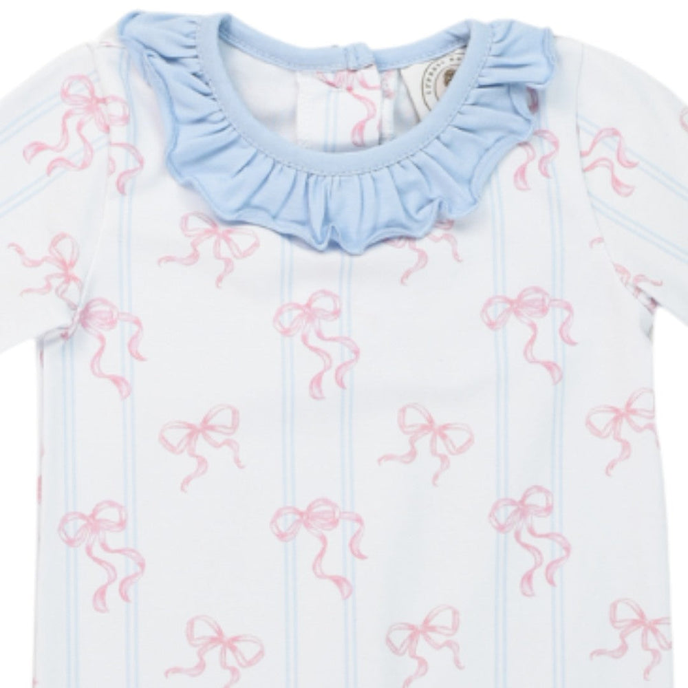 That Store girls Riley romper featuring a white fabric with pink bow print and a light blue ruffled collar neckline.