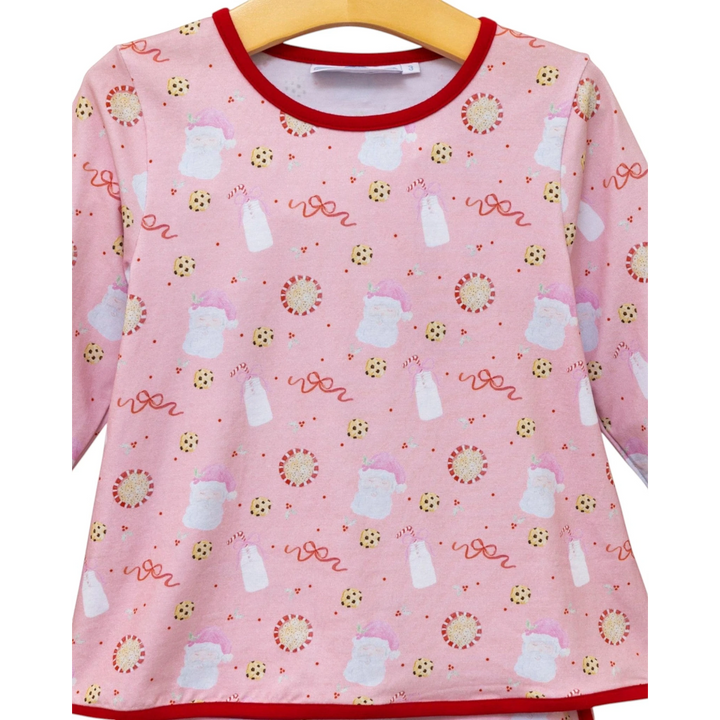 That Store girls pink Christmas lounge set featuring a playful Santa, milk, and cookie print on soft cotton fabric.