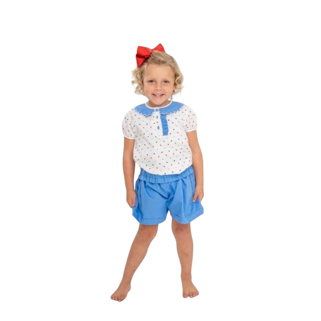 That Store girls set featuring a white polka dot top with blue scalloped collar and matching blue cuffed shorts.