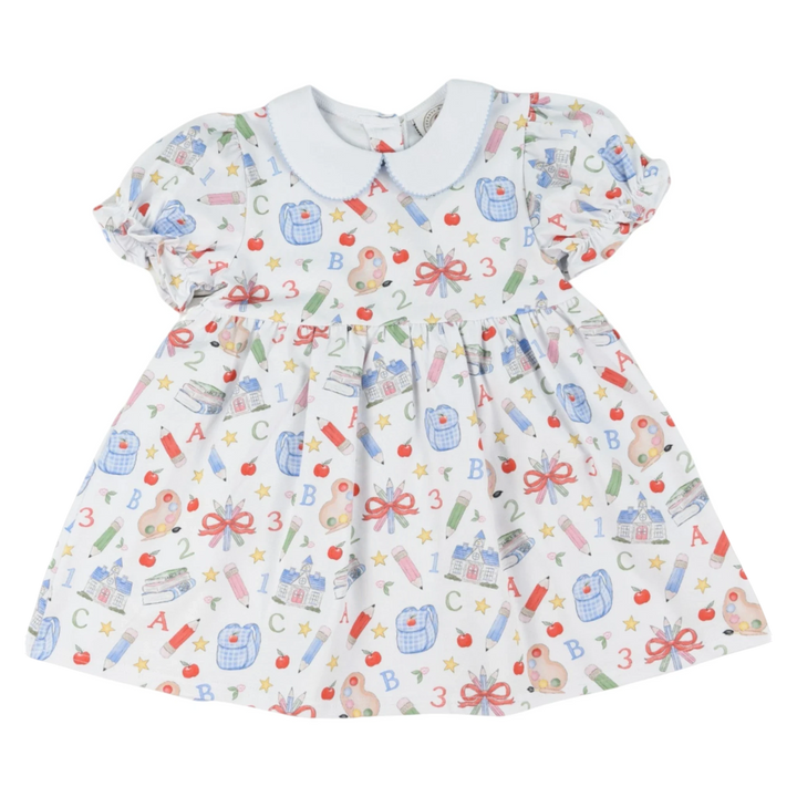 That Store girls red Collins classic dress with a playful school supplies print and a white Peter Pan collar.