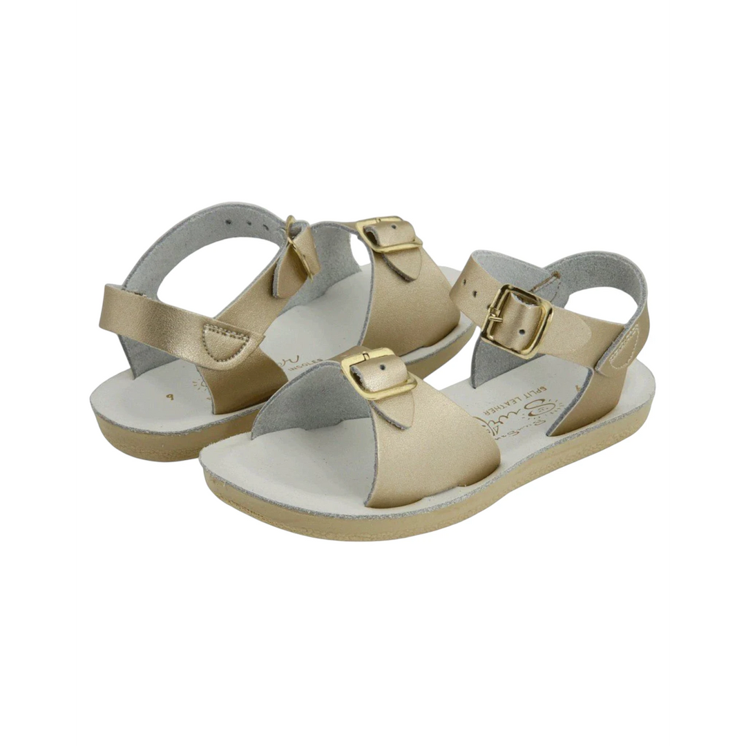 That Store Gold Surfer Sandals with water-friendly leather, brass buckles, and flexible outsoles for summer play.