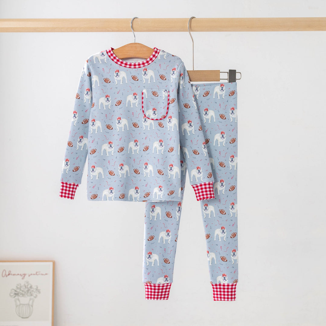 That Store gray organic cotton kids pajama set featuring a bulldog and football print with red gingham trim