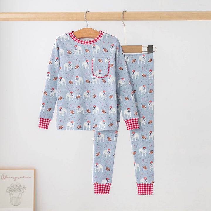 That Store gray organic cotton kids pajama set featuring a bulldog and football print with red gingham trim